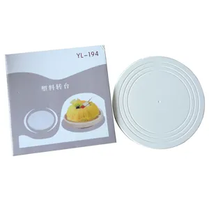 Plastic cake turntable for baking and decorating, stable low center design with anti-slip rings.