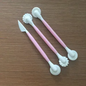 3-piece fondant cake decorating tools set, pink and white plastic sculpting pens and knives.