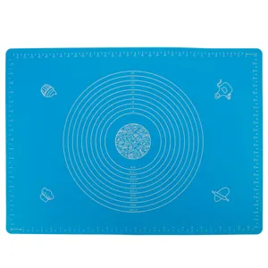Blue silicone kneading mat for baking, non-slip pastry mat with measurement conversion charts.