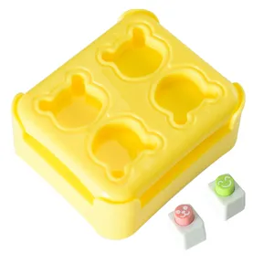 Cute cartoon bear rice ball mold set with mini nori embosser, ideal for DIY bento box making.