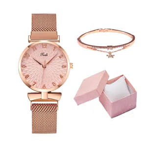 Set orologio da donna al quarzo oro rosa con cinturino in maglia e confezione regalo.