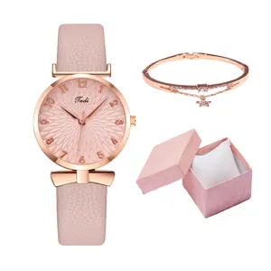 Elegante set regalo con orologio al quarzo rosa e bracciale con stelle e scatola per donna.