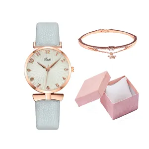 Set regalo orologio da donna al quarzo e bracciale con cinturino in pelle grigia.