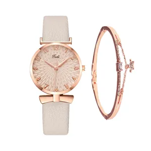 Set orologio al quarzo e bracciale moda donna con quadrante rosa e cinturino pelle.