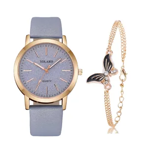 Dettagli del set orologio donna con cinturino grigio, cassa oro rosa e bracciale farfalla strass.