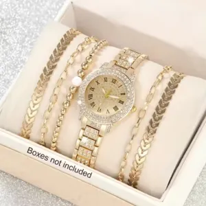 Primo piano di orologio da donna dorato al quarzo con set di bracciali coordinati.