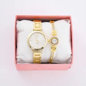 Orologio donna quarzo oro e set bracciale strass, dettaglio scatola regalo moda elegante.