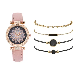 Set orologio donna al quarzo con cinturino rosa quadrante fiore strass e quattro bracciali.