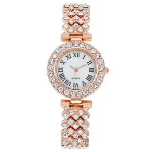 Orologio da donna al quarzo oro rosa con strass numeri romani e cinturino scintillante.