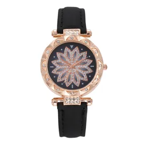 Orologio al quarzo da donna con quadrante a fiore in strass e cinturino, bel dettaglio.