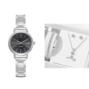 Orologio da donna al quarzo minimalista abbinato a set di gioielli con bracciale tennis.