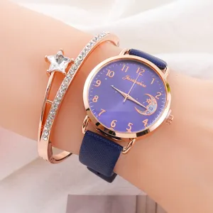 Primo piano dettaglio elegante orologio donna al quarzo con quadrante blu e bracciale.