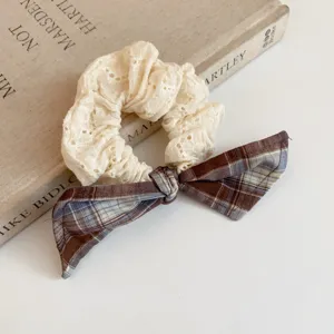 Preppy style brown plaid and white lace hair scrunchie with cute ribbon bow for women daily wear.