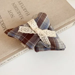 Brown plaid hair tie with beige lace bow, vintage preppy style fabric scrunchie for women.