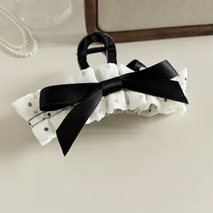 Korean style polka dot pleated bow hair claw clip, elegant black and white hair accessory for women.