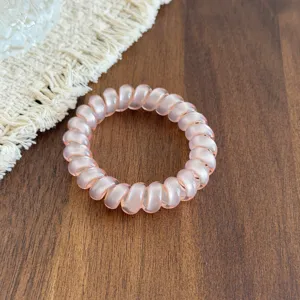 Transparent pink telephone wire hair tie, flexible spiral hair band for daily cute ponytail.
