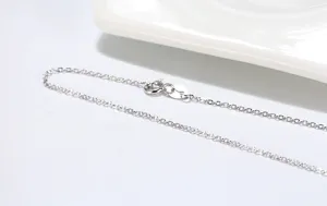 Detailed view of the sterling silver O-chain necklace, featuring fine links and secure clasp.