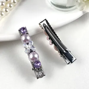 Exquisite rhinestone pearl hair clip detail, sparkling purple crystals and elegant design for women.