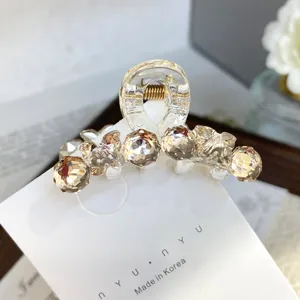 Small rhinestone hair claw clip for bangs and side hair, clear acrylic crystal design for styling.
