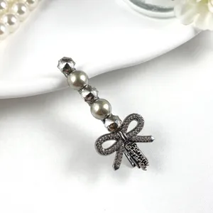 Elegant crystal rhinestone bow hair clip, stylish metal side clip for women and girls daily wear.