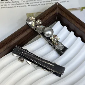 Silver metal hair clip decorated with sparkling rhinestones and a grey pearl for daily fashion styling.