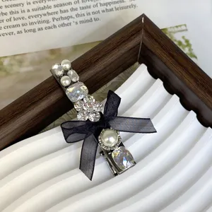 Elegant pearl rhinestone hair clip with black bow, sweet side bangs clip for women daily wear.