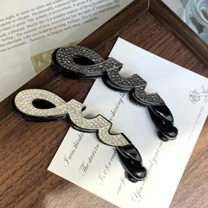 Rhinestone paperclip hair clip detail, stylish black PC base ponytail banana hairpin for women.