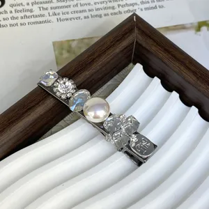 Silver metal hair clip with sparkling crystals, rhinestones and pearl for women daily styling.