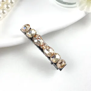 Exquisite crystal hairpin detail view, sparkling champagne rhinestones on metal barrette.
