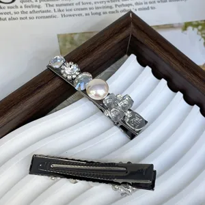 Silver metal hair clip set featuring elegant pearls and sparkling crystals for women.