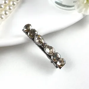 Detailed close-up of a vintage crystal barrette featuring multi-faceted K9 rhinestones.
