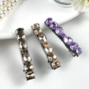 Detailed close-up view of elegant K9 crystal hair clips with sparkling stones, exquisite craftsmanship.