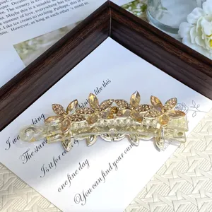 Crystal flower banana hair clip detail, elegant rhinestone hair accessory for women styling.