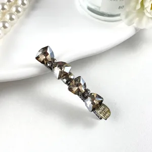 Sparkling crystal rhinestone bow hair clip elegant side hair accessory for women.