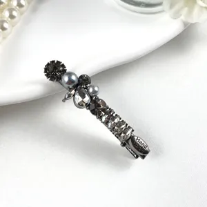 Exquisite rhinestone and faux pearl hair clip detail, elegant duckbill clip for women.