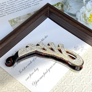 Elegant rhinestone inlaid banana clip for women, exquisite hair claw and tail styling accessory.