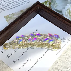 Elegant crystal hair banana clip with dazzling rhinestone leaves for daily styling wear.