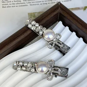 Silver hair clips set with pearl and rhinestones elegant bow design side clips for women.