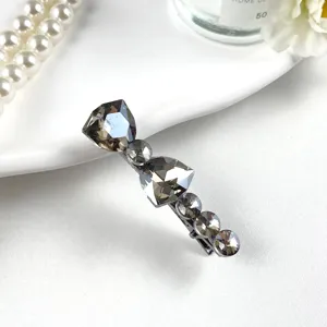 Elegant crystal rhinestone hair clip for women, sparkling grey diamond hair barrette accessory.
