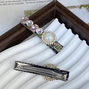 Silver hair clip featuring sparkling crystals, rhinestones and pearls for stylish daily wear.