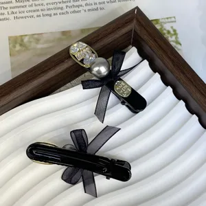 Detailed view of elegant double-sided bow rhinestone pearl hair clip, sweet cute side clip.