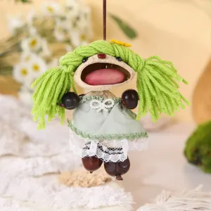 Handmade natural nut shell doll pendant, cute green yarn hair hanging ornament for bag decor.