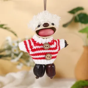 Handmade natural seed shell hanging doll ornament with cute knit sweater and creative design.