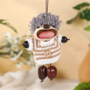 Handcrafted natural nut shell doll pendant, cute wool hair and knitted sweater details.