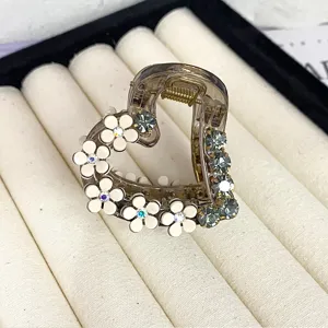 Elegant floral hair claw clip with rhinestones and crystals, perfect for stylish daily wear.