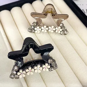 Rhinestone star camellia hair claw for women, elegant small shark clip for thin hair detail.