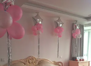 Wedding room decoration balloon set with silver rain silk curtain and party hanging ornaments.