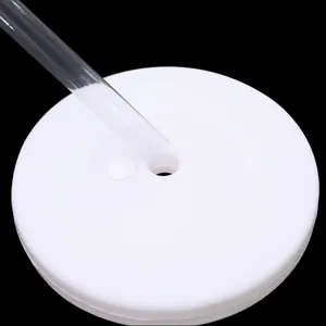 Detail view of the white balloon column base with a clear plastic support rod insert.