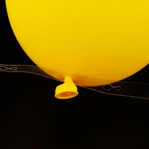 Clear balloon chain strip for party arch decoration with yellow latex balloon, easy setup.