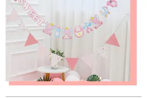 Pink elephant banner detail showcasing cute letters and hanging party decoration.